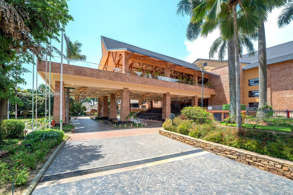 Speke Resort entrance surrounded by palm trees and landscaped gardens